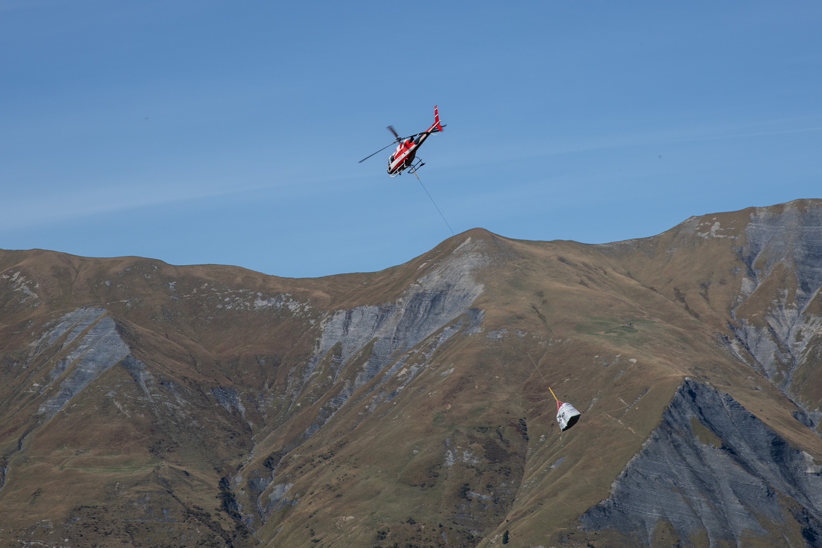 Helicopter air lifting materials from Refuge Tre la Tete  